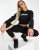 ellesse cropped jumper & jogger set in black – Discount